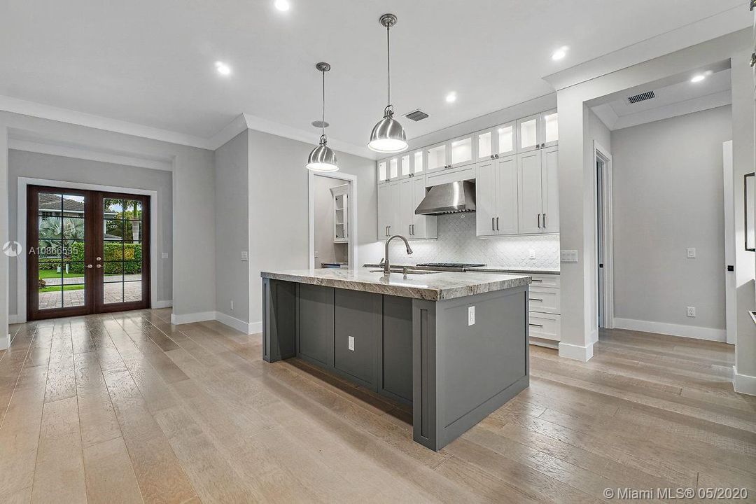 View of kitchen and foyer entry