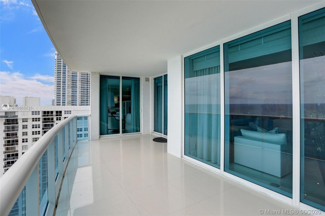 Large balcony with direct ocean view.