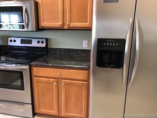 matching stainless appliances and fridge with water and ice in the door