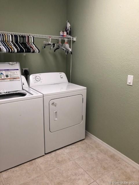 laundry room with washer and dryer