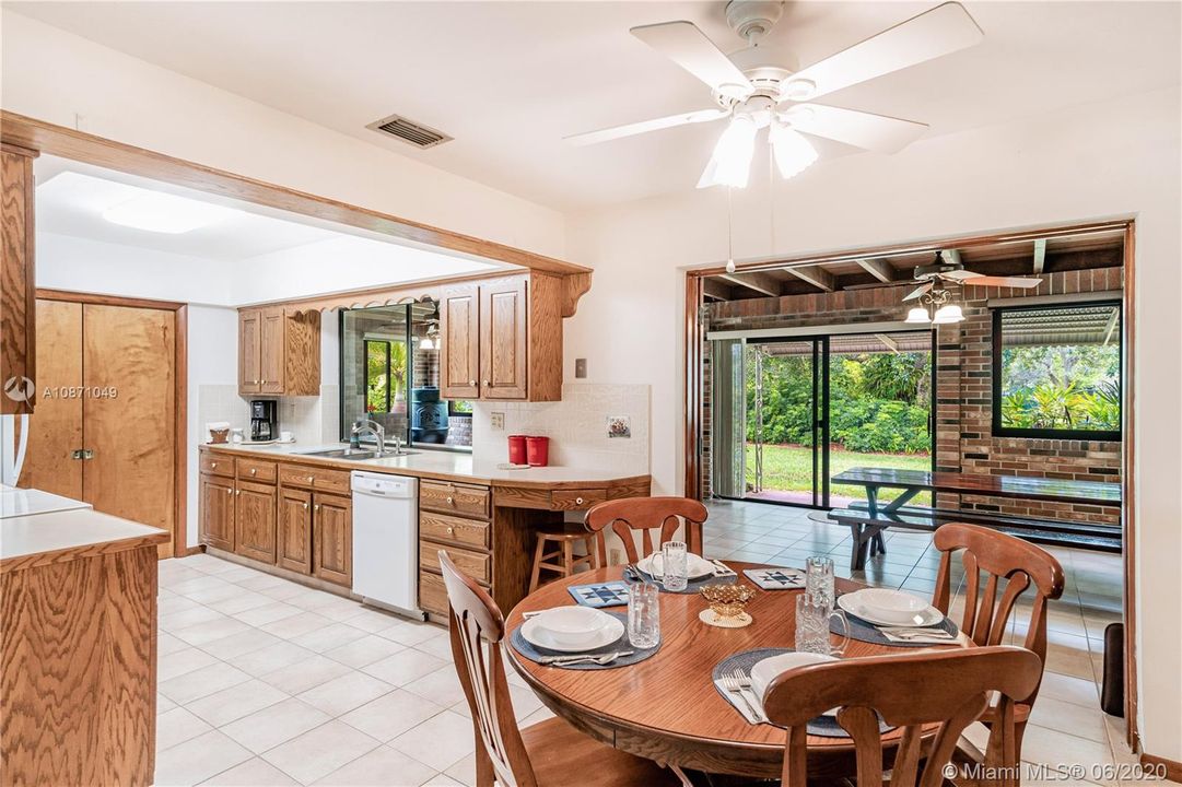 Dining room/kitchen and family in the background
