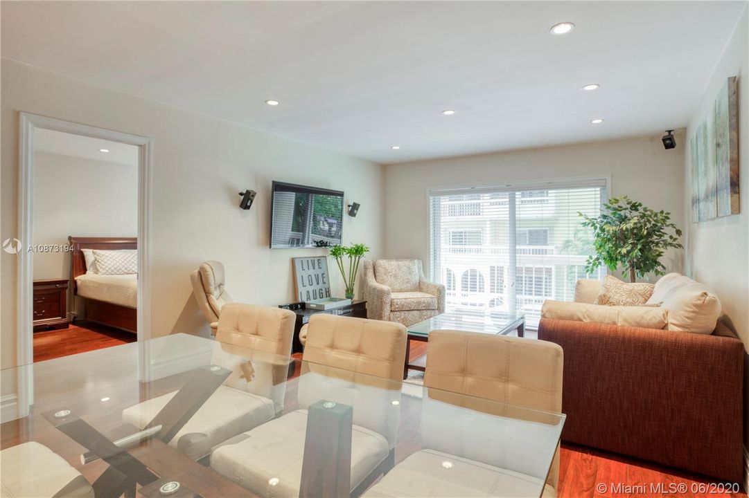 Recessed lighting and warm beige painted walls throughout