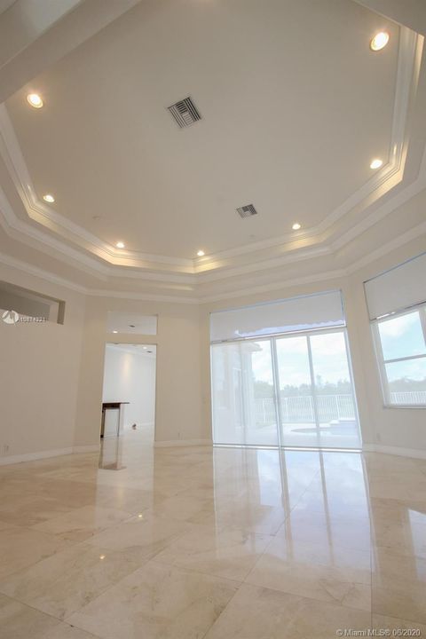 LIVING ROOM AND DINING ROOM WITH VAULTED CEILING