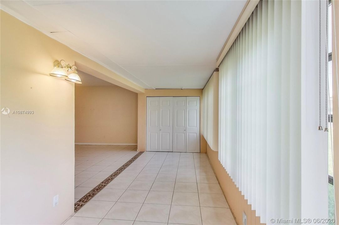 Open living space from converted room facing storage closet