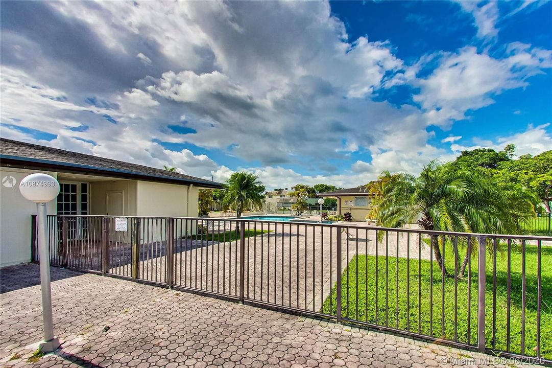 Gated pool with access to clubhouse and pool house - Unbranded 360 VT at: www.rem.ax/16992swunb