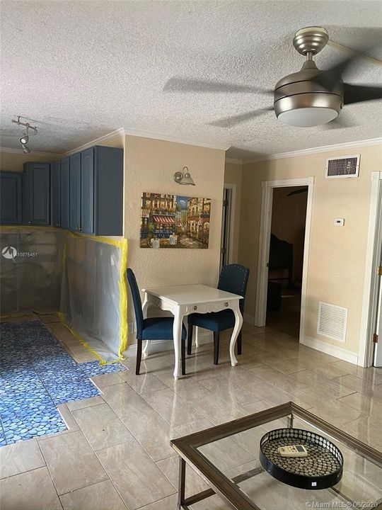 view of partial kitchen, dining, bedroom from living room