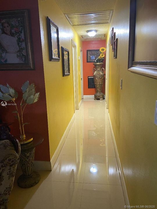 HALL ENTRANCE TO BEDROOMS AND BATHROOM