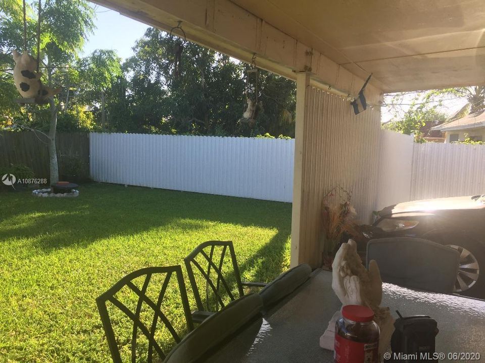 RIGHT SIDE OF FENCED BACKYARD