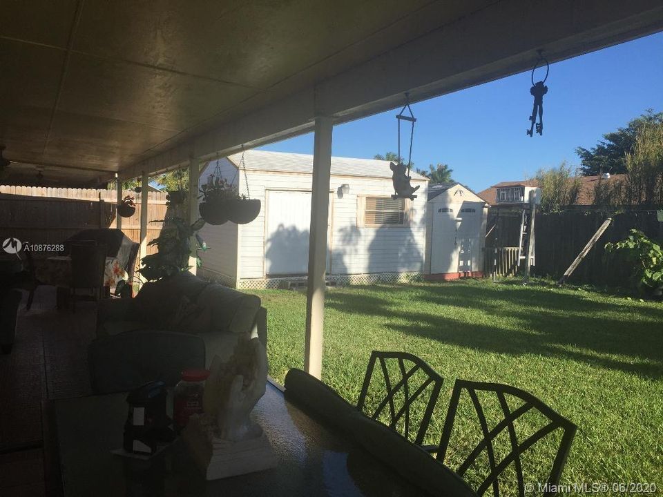 LEFT SIDE OF BACKYARD WITH HUGE SHED