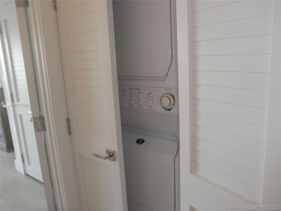 WASHER/DRYER COMBINATION ON SECOND FLOOR BETWEEN MASTER BEDROOMAND GUEST BEDROOM