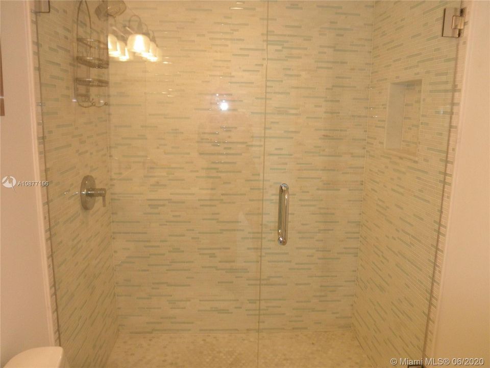 MASTER BATH SHOWER WITH MARBLE & GLASS TILE ON WET WALLSAND NOOK FOR BATH PRODUCTS