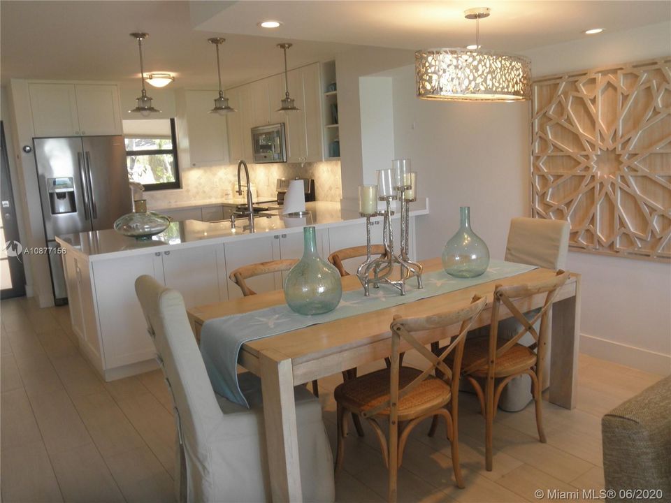 VIEW OF DINING AREA AND KITCHEN FROM LIVING ROOM