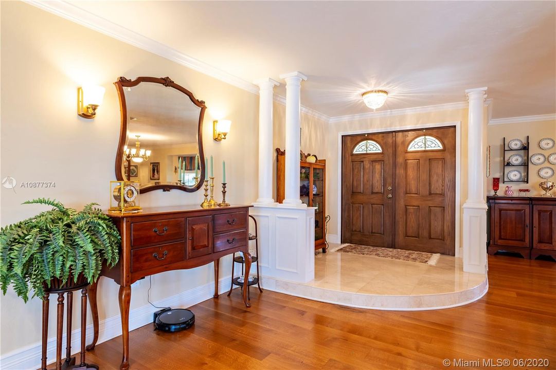 Won't your guests be impressed with this beautiful foyer with marble floors?
