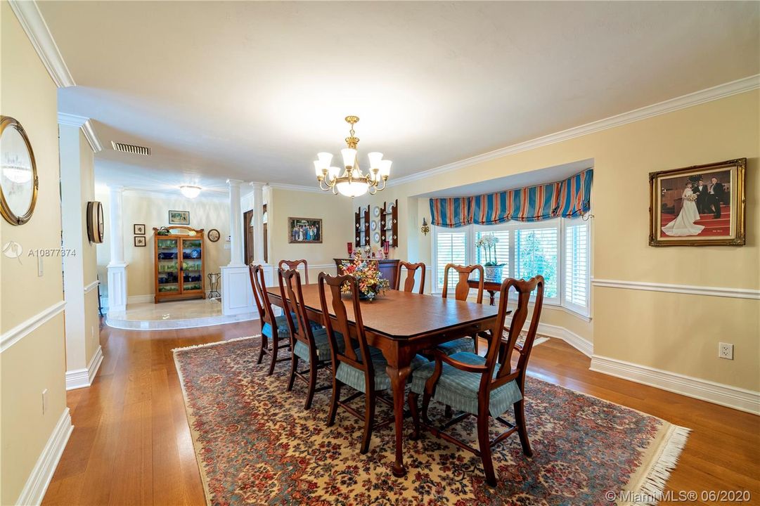 Bring all the relatives to enjoy the holidays in this formal dining room with bay window.