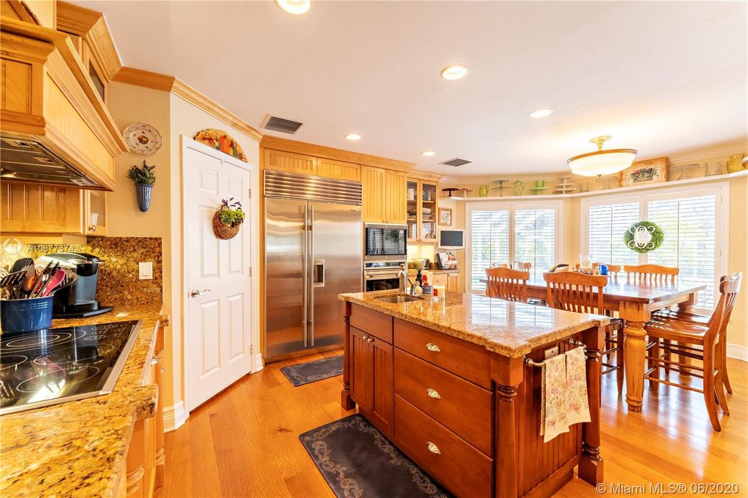 Eat-in kitchen area with bay window.