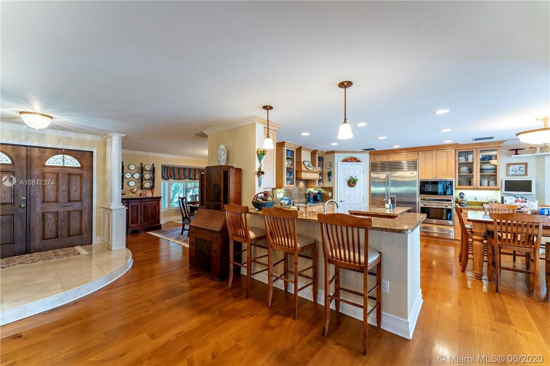 Marble foyer, then down to delightful kitchen or formal dining room.  Beautiful oak floors.