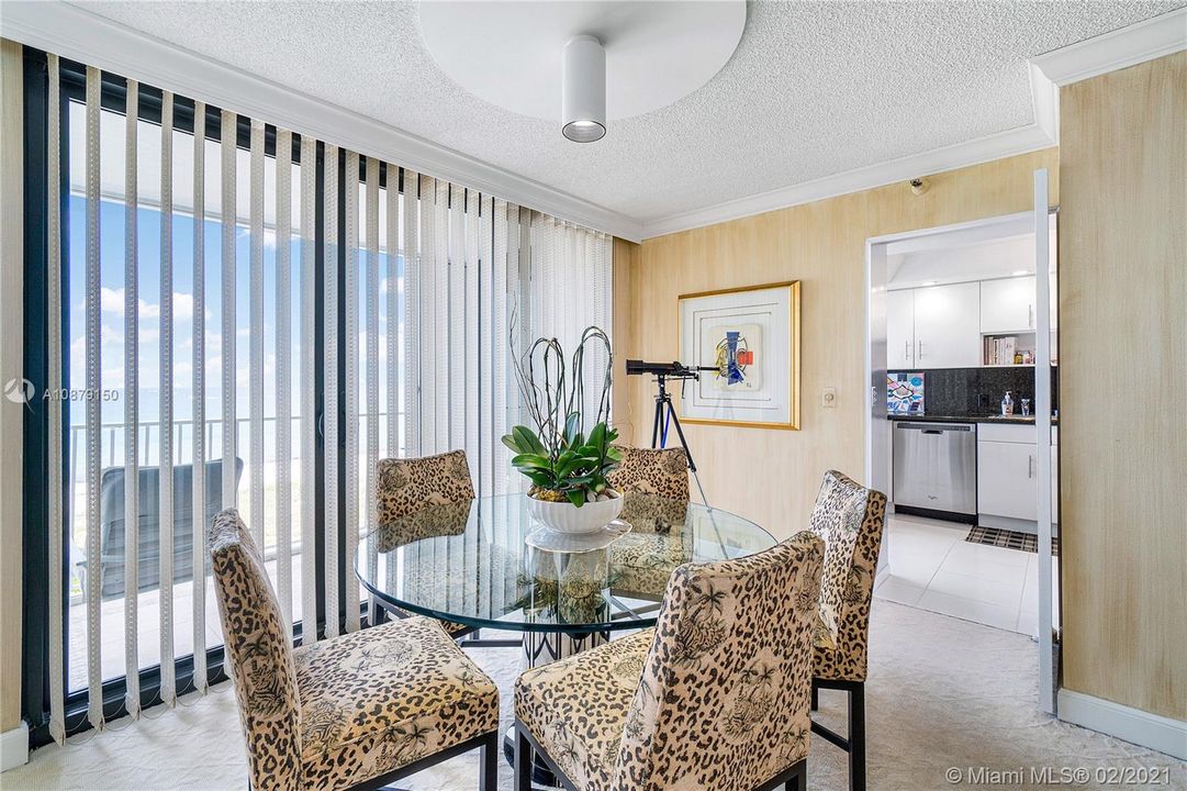 Dining Area (south side of apartment overlooking ocean) - Kitchen in background
