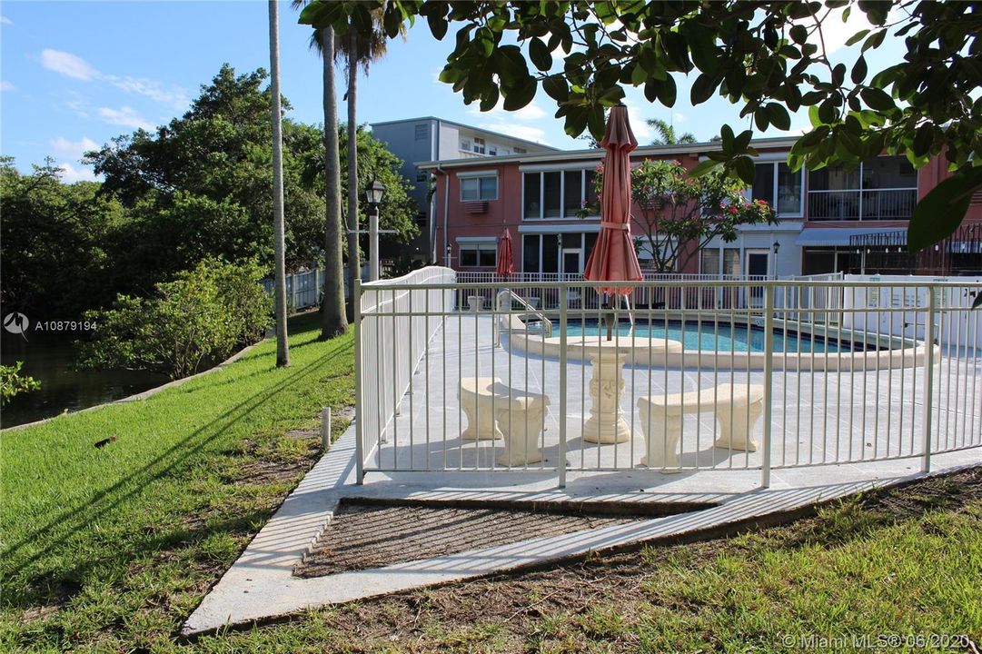 The patio table and a few lounge chairs are available when you spend time at the pool.