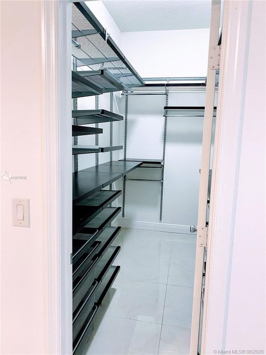 Master Walk-in closet w. Container Store organizers
