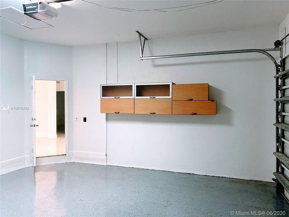 2 Car garage W. Epoxy finished floor & Storage cabinets
