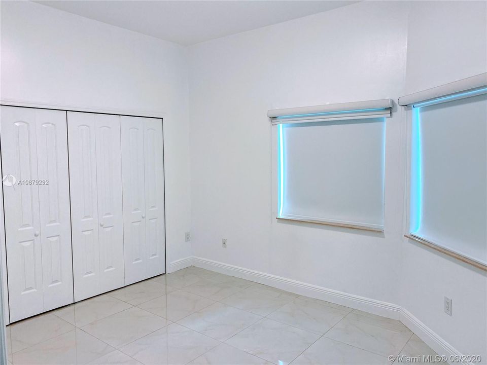 1st Bedroom w double closet and large window area.