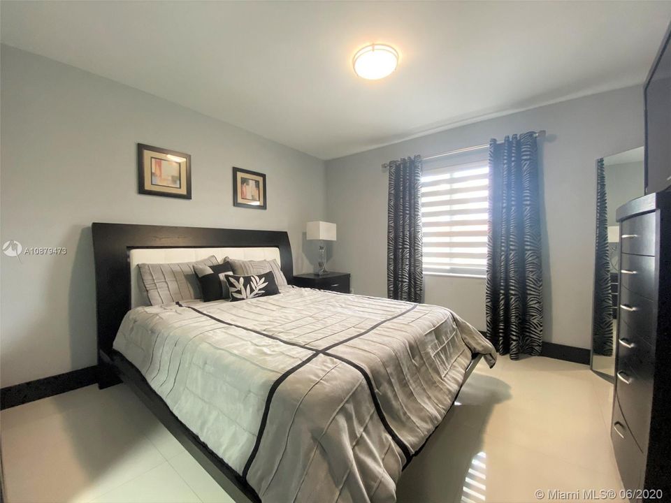 Fourth bedroom that has built-in walk-in closet.
