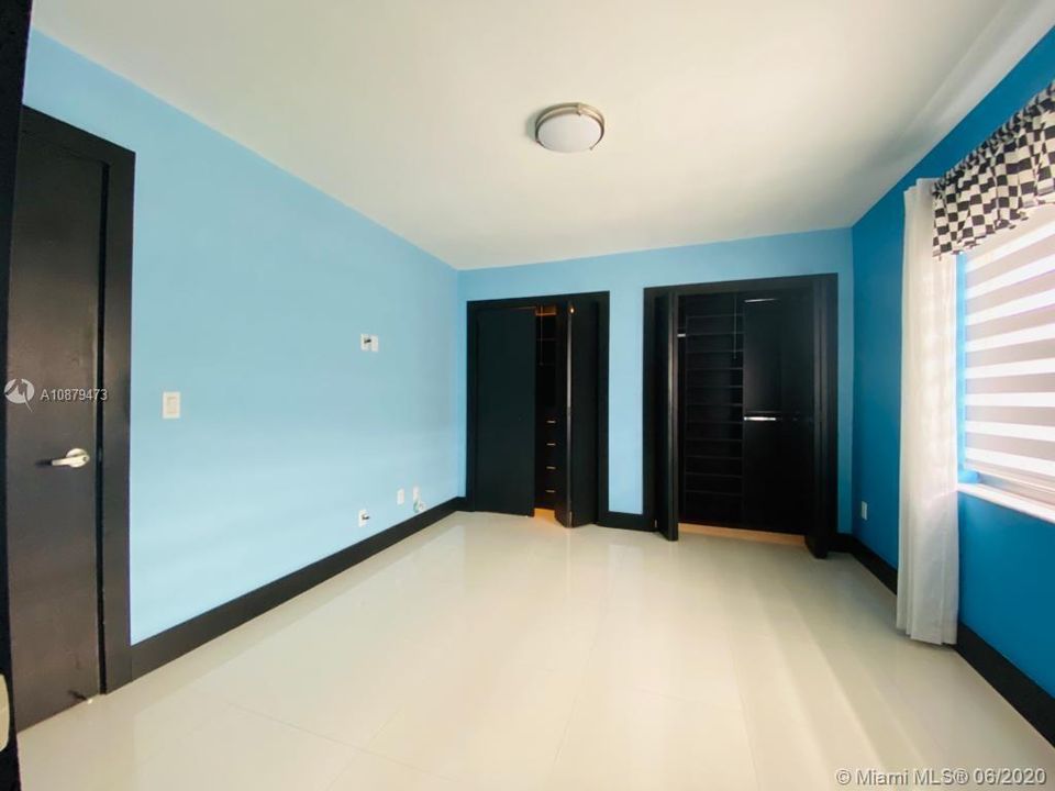 Third bedroom with wall-to-wall built-in closet.