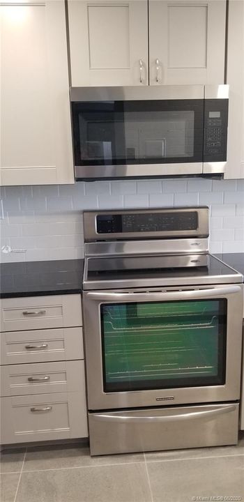brand new stainless steel microwave and range