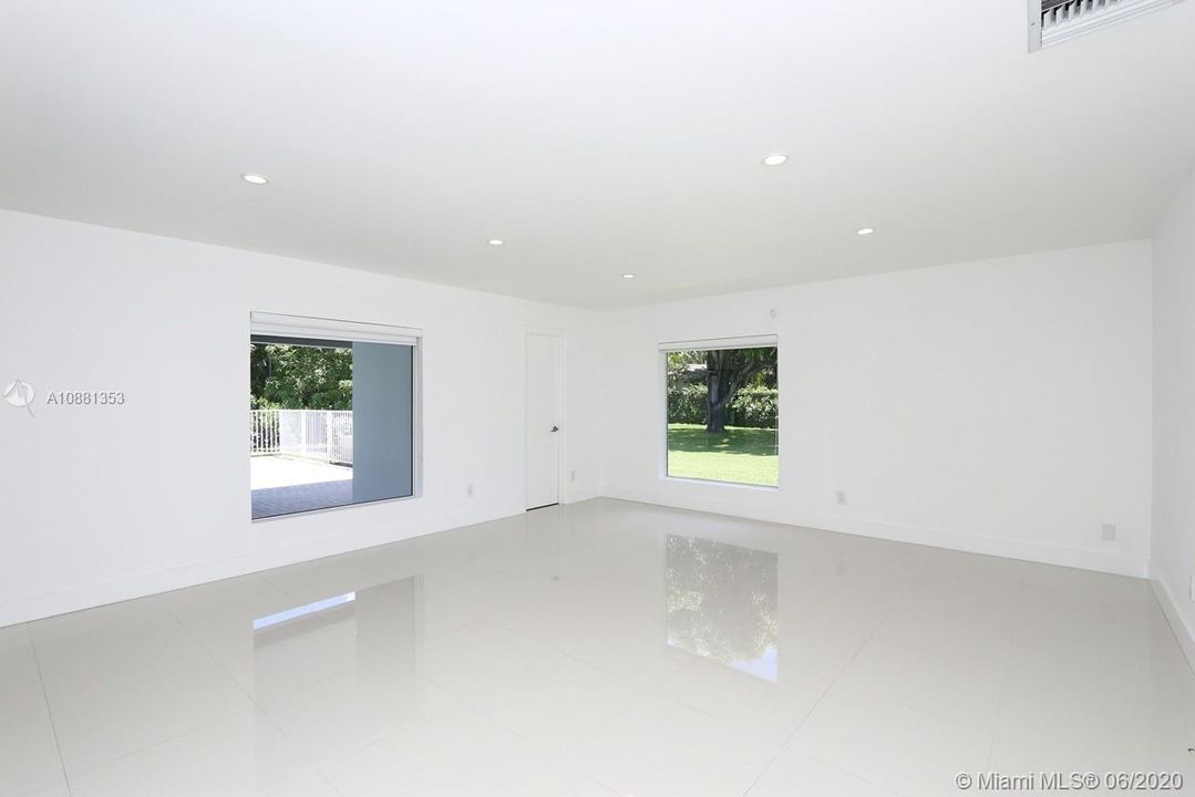 Family Room. The door to the right is the 3rd full bathroom and cabana bath