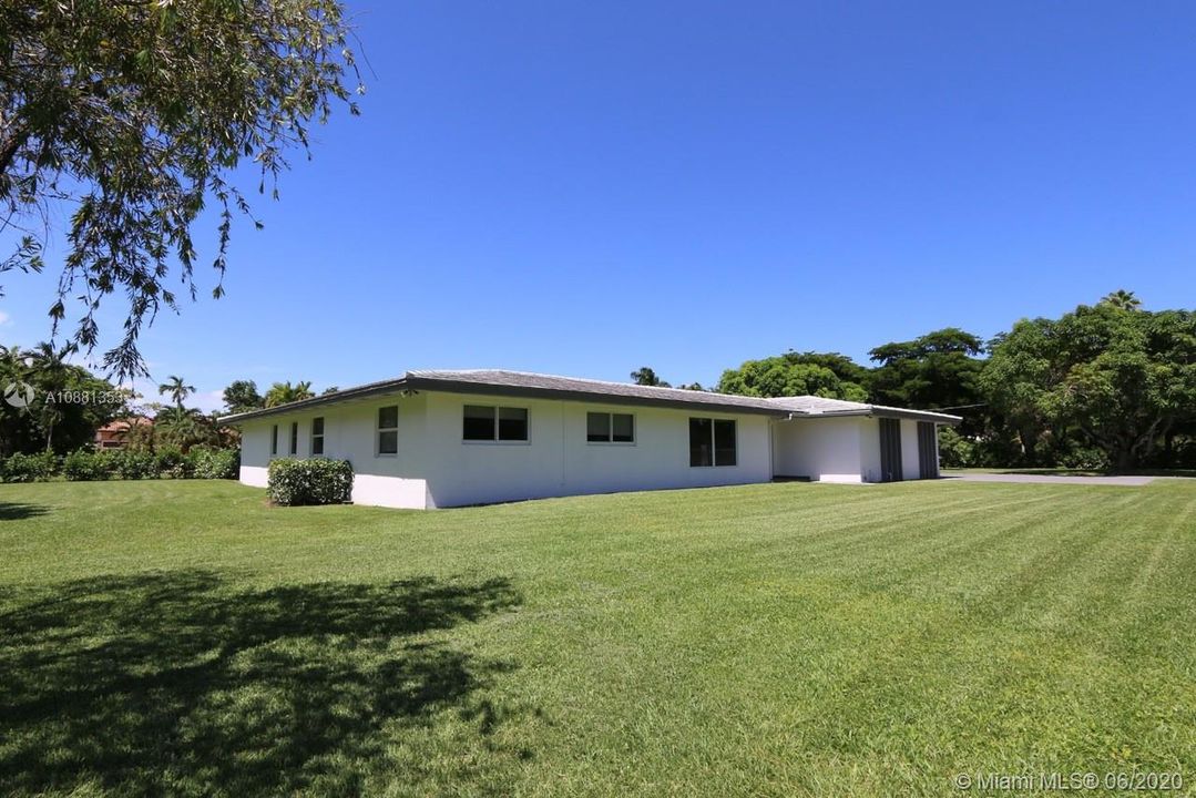 Beautiful yard surrounds the house. Yard maintenance is included in rent