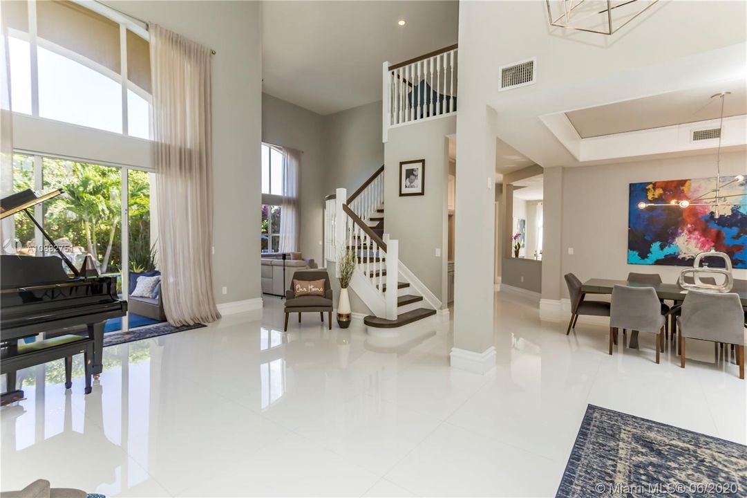 Open formal living to dining room and family room.