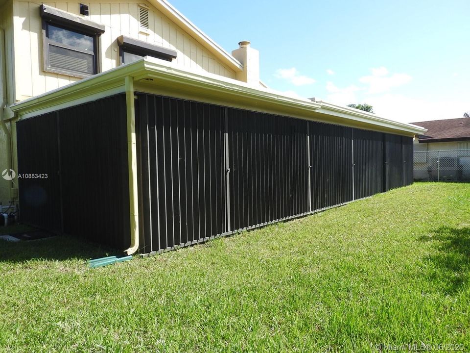 Full accordian shutters around screen patio