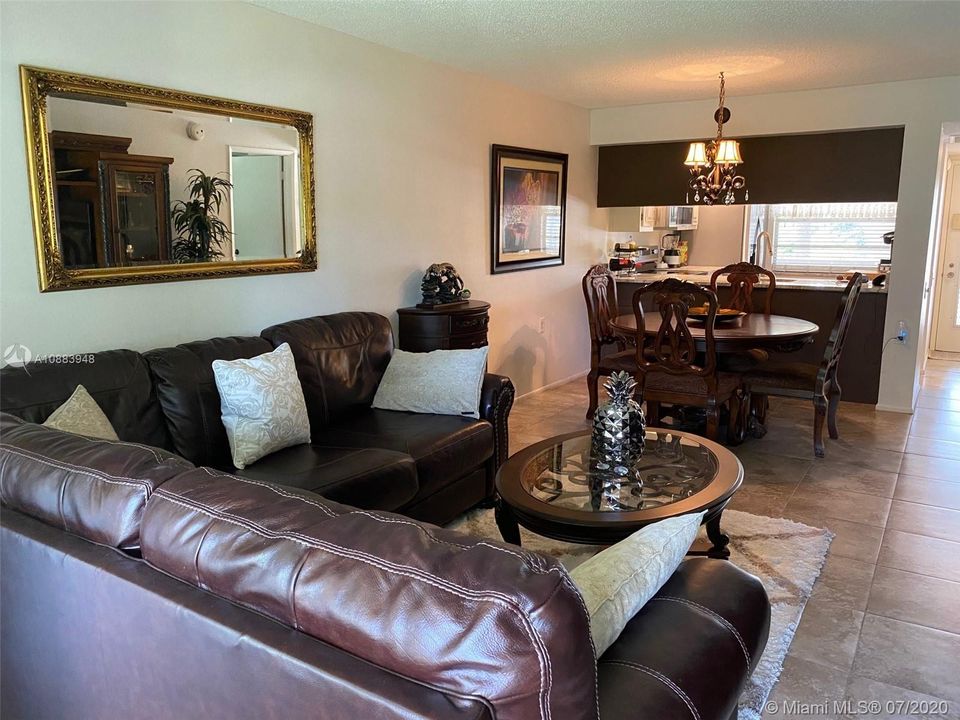 ALTERNATE VIEW OF THE INTERIOR - LIVING/FORMAL DINING ROOM AREA