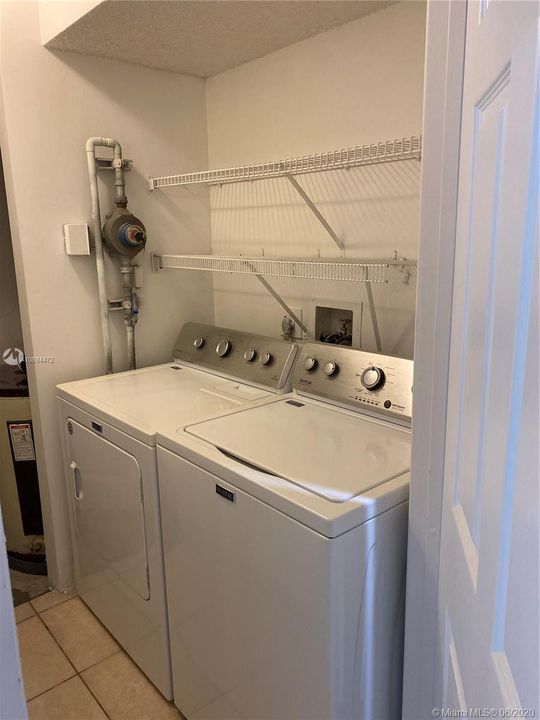 LAUNDRY AREA WITH FULL SIZE WASHER AND DRYER