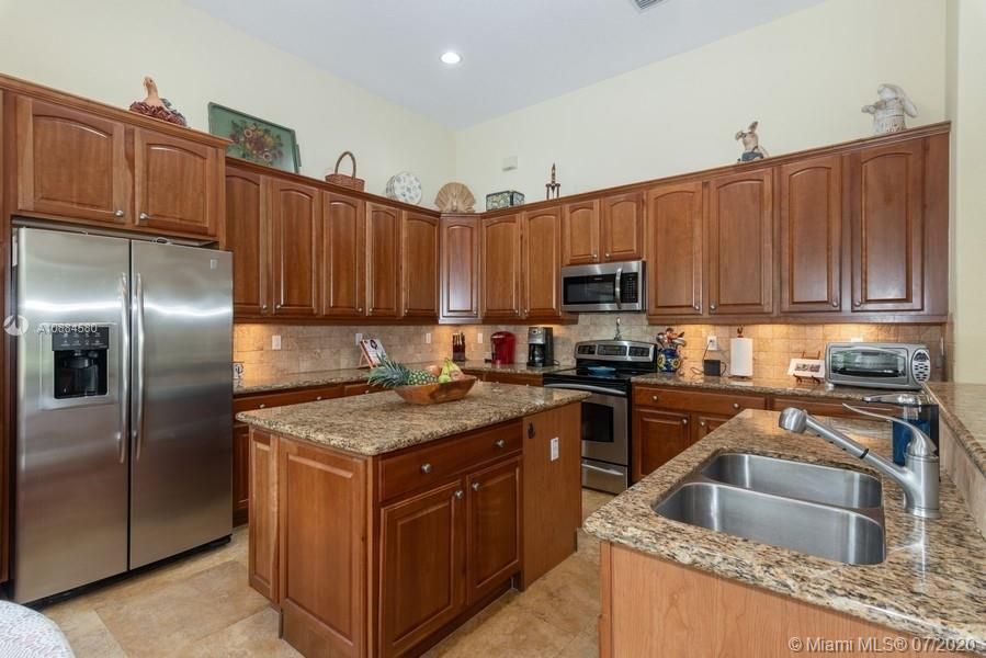 Updated kitchen cabinets and granite countertops. GE Appliances.