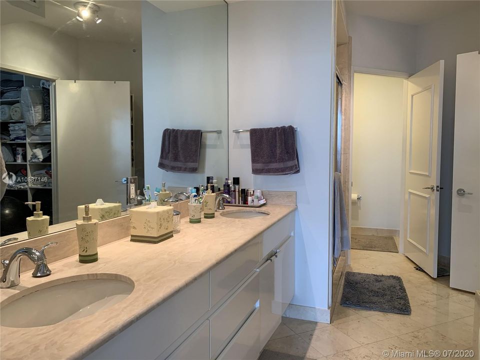Master bathroom with dual sinks, and separate shower