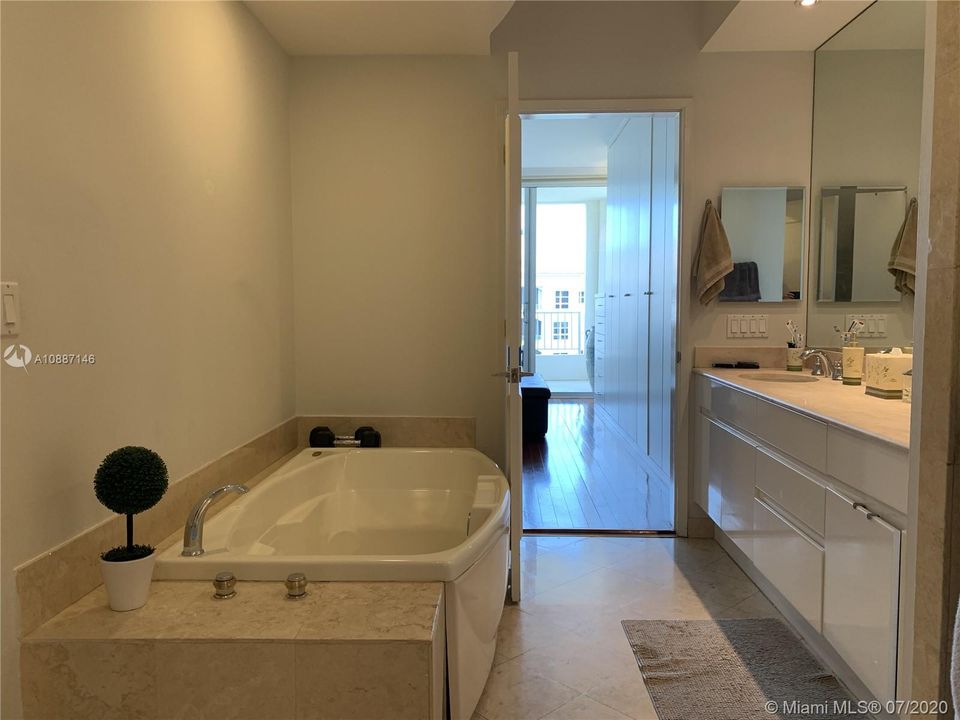 Master Bathroom with separate tub and dual sinks