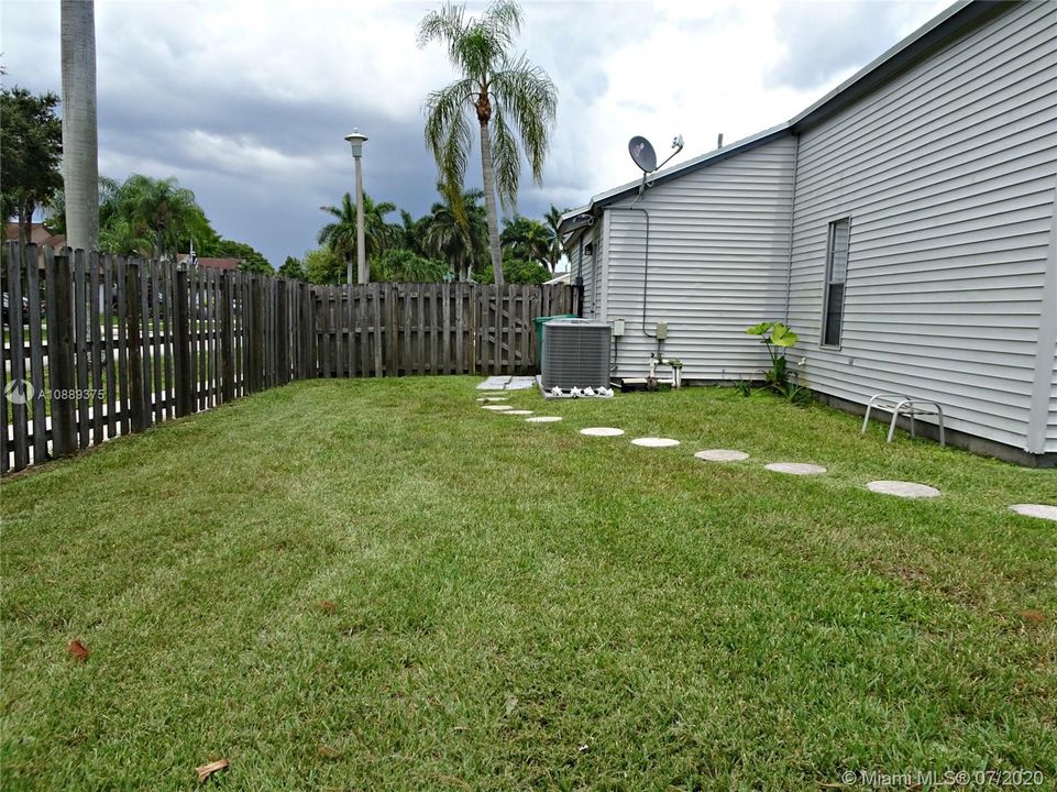 The yard is completely fenced with a 6 foot shadow box fence.  There is plenty of room on the side yard to park your boat or RV!!!!
