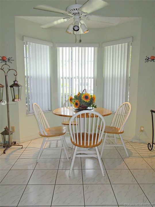 Breakfast nook in the kitchen has a beautiful bay window.
