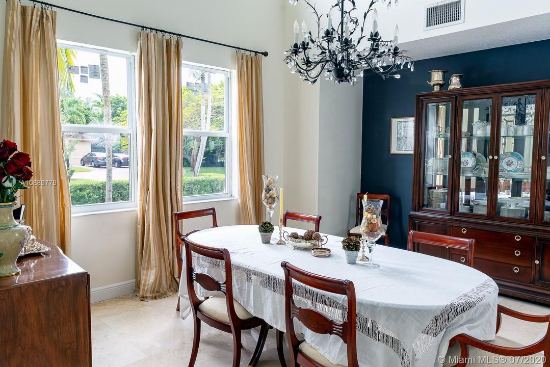 Large dining room with two story ceiling perfect for entertaining.
