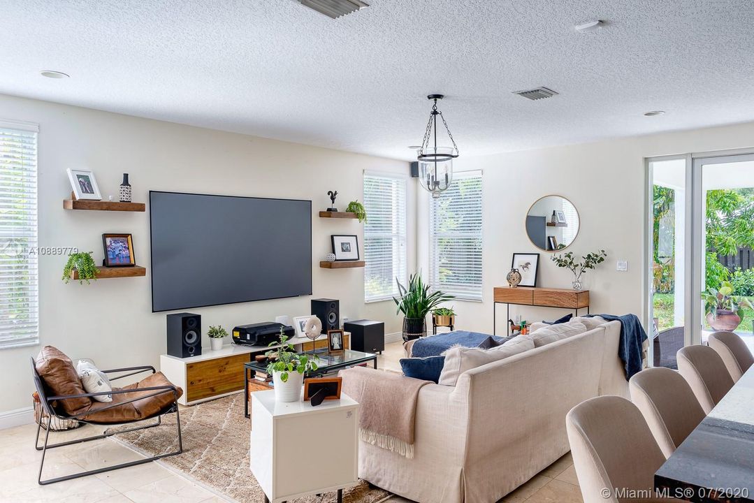 Large family room with a view to the backyard and pool.