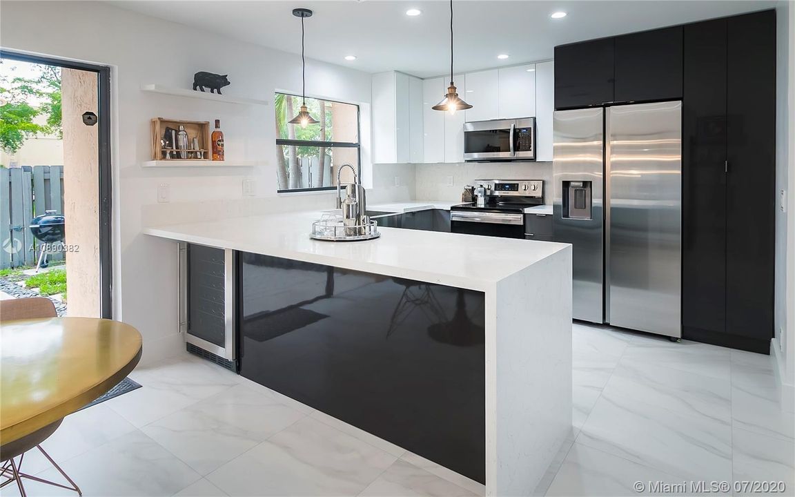 Brand New Kitchen with Custom Cabinets, Custom Waterfall Quarts Counter tops and back splash, All Brand New Stainless Steel Appliances, Custom Wine Cooler, Stainless Steel Farm House Sink