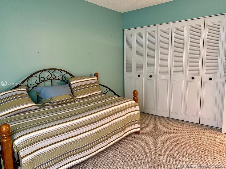 HUGE WALL OF CLOSETS WITH CLOSET SYSTEM