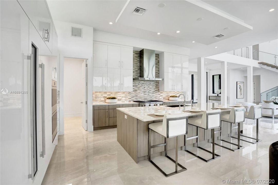 Gas cooktop, microwave drawer. Multi-cycle quiet dishwasher. Double oven with convection. Oversized island. Sub zero refrigerators.