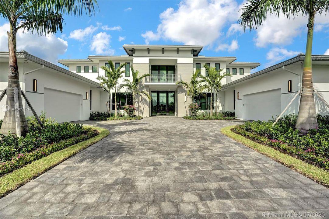 Grand entrance with four car garage. Impact windows & doors. Impressive front entry doors. Brick pavers. Hurricane garage doors. Professionally landscaped. Stucco finished. Multi-zone high efficiency air conditioners. Digital thermostats. Two tankless water heaters. Prewired for ceilings fans. All windows solar tinted.