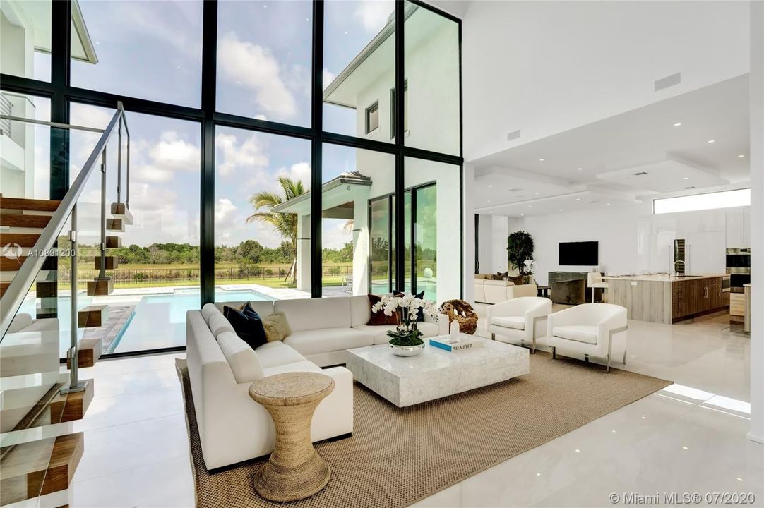 Formal Living room with floor to ceiling impact glass.