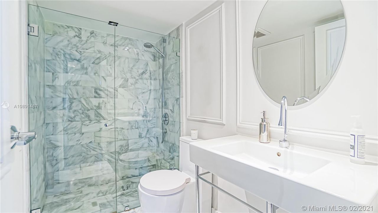 Elegant bathroom with Carrara Marble Shower.