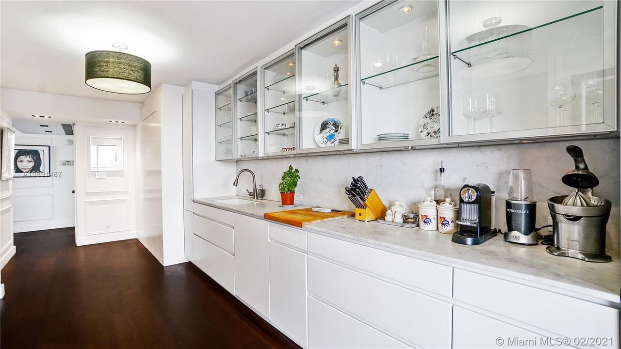 Well appointed Gourmet Kitchen with plenty of storage and pantry.  Carrara marble countertops.