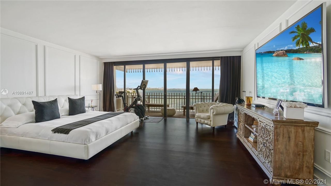 Spacious Master Bedroom Suite with private balcony and oversized custom walk- in closet.