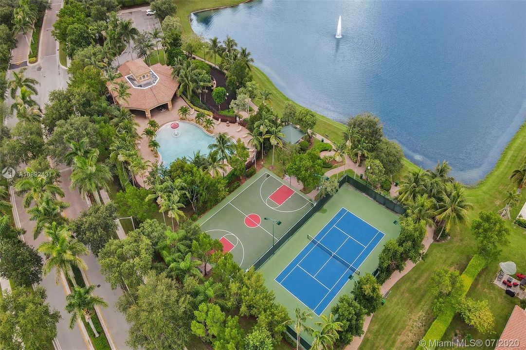 Arial view of clubhouse, pool, basket ball and tennis courts.